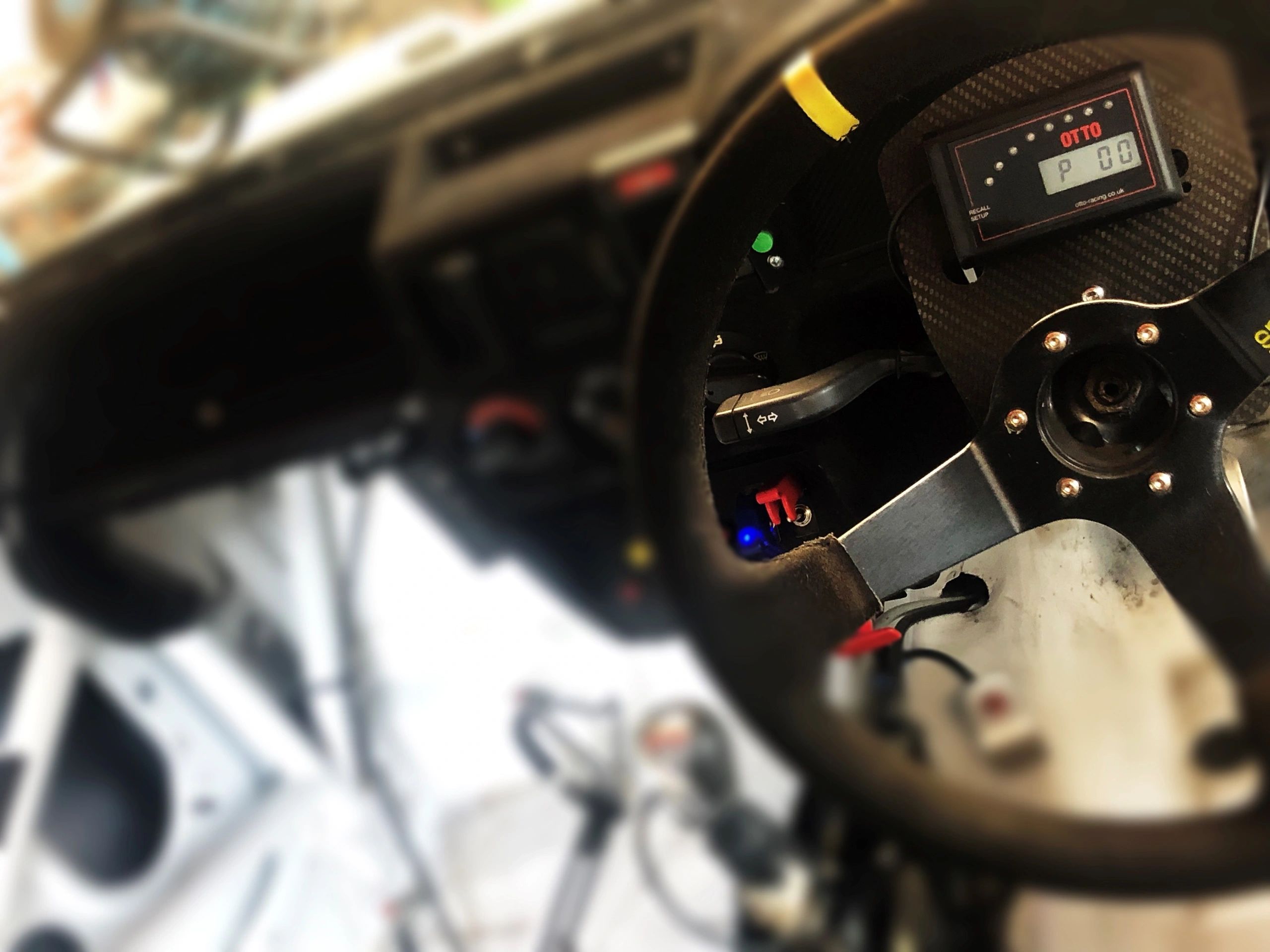 Race car cockpit with carbon dash and steering wheel